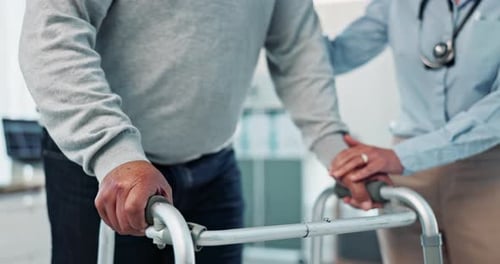 Healthcare Worker Helping Senior Adult with Walker