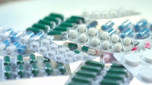 Pharmaceutical Pills Package on White Table. Tablets Package. Close Up of Pharmacy