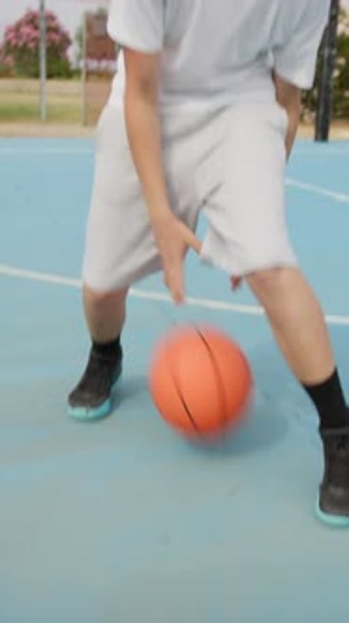 Blond Athlete Dribbles In Outdoor Basketball Court