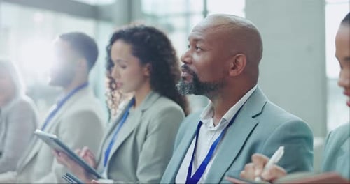 Business Professionals at Corporate Conference Indoors