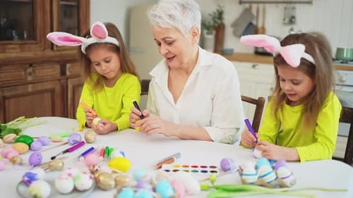 Happy Easter Two Little Girls Sisters Twins Grandmother Painting Eggs Enjoying Time Together Happy
