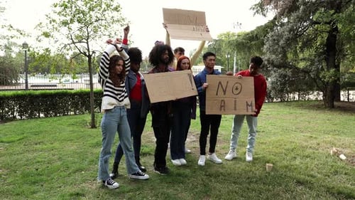 Group of Young Adults Protesting in Park