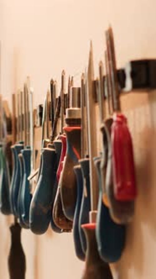 Vertical Video Close Up of Woodworking Tools on Rack Used for Carving Wood Surfaces