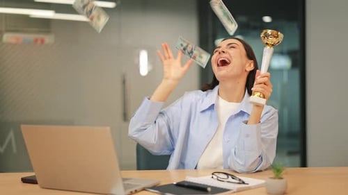 Excited Woman Celebrating Win with Money and Trophy