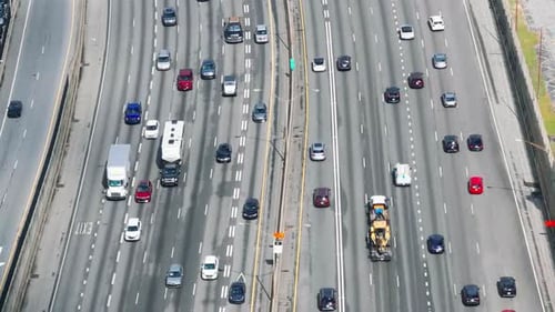 Tracking of cars driving on busy wide highway. High angle view of transport infrastructure. Atlanta,