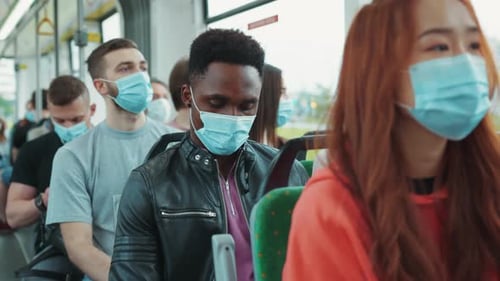 People Wearing Masks Riding Public Transportation