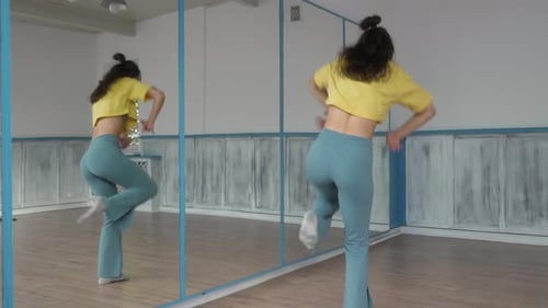 Woman Dancing and Stretching in Front of Mirror