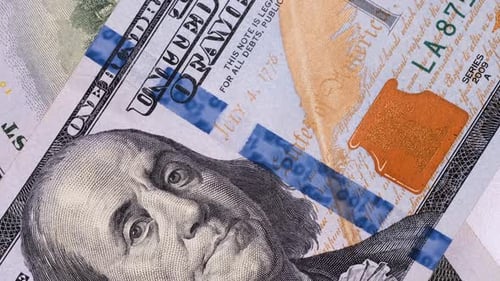 100 dollar banknotes fast rotating macro close-up. Hundred dollars paper money, cash currency