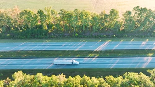 View From Above of Busy American Highway with Fast Moving Trucks and Cars