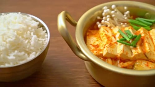 ‘Kimchi Jjigae’ or Kimchi Soup with Soft Tofu or Korean Kimchi Stew - Korean Food Traditional Style
