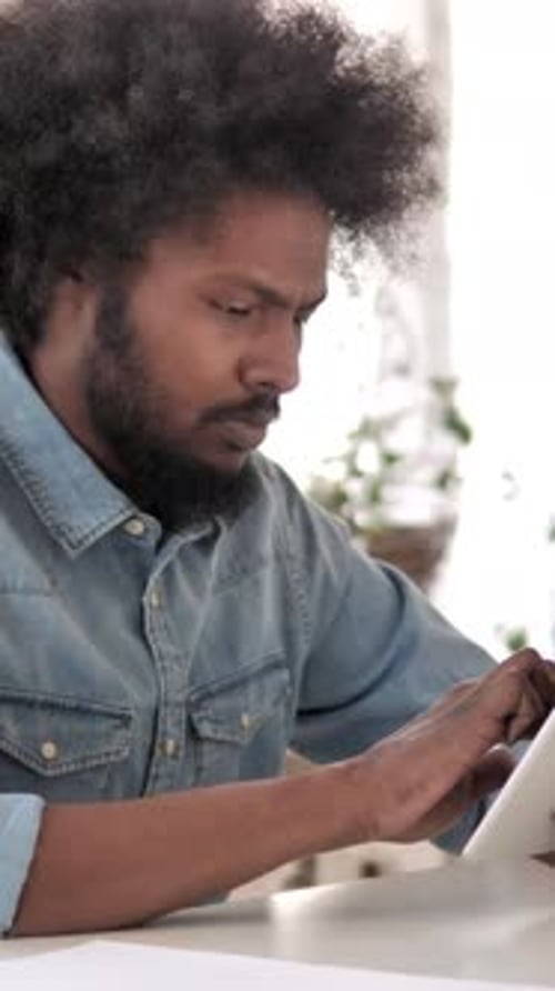 African Man Using Tablet, Vertical Video