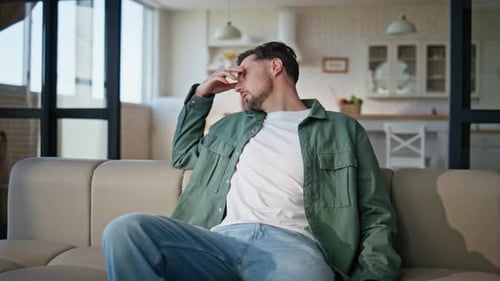 Closeup Man Falling Sofa Feeling Tired at Home Weary Guy Taking Rest Sitting