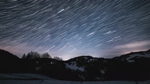 Star Trails Time Lapse Over Winter Mountain Landscape