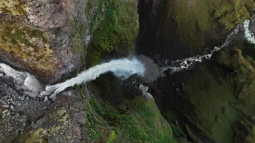 Aerial View of Powerful Waterfall in Mulagljufur Canyon, Iceland