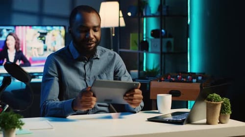 Man Presents During a Webcast in Home Studio