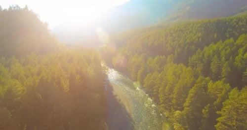 Low Altitude Flight Over Fresh Fast Mountain River with Rocks at Sunny Summer Morning