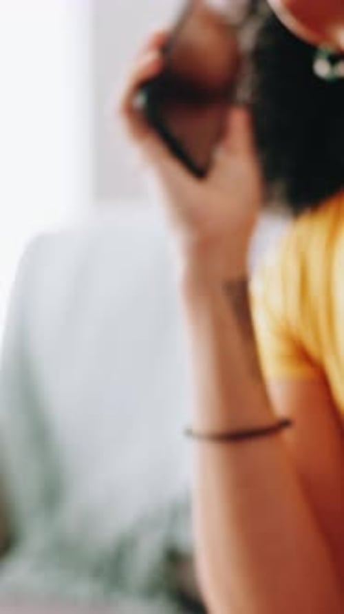 Woman Smiling, Talking on Cellphone Indoors