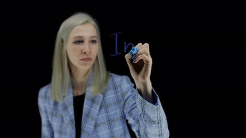 Industy Words Written By Hand on a Transparent Board and a Dark Background A Young Girl with Blonde