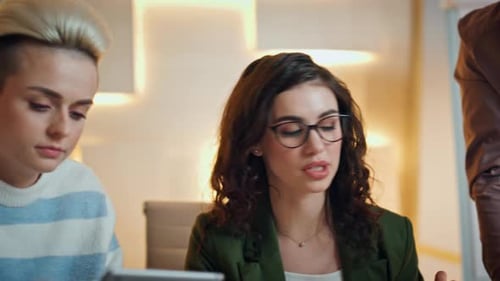 Diverse Group Discussing Company Work at Business Meeting in Office Young Team