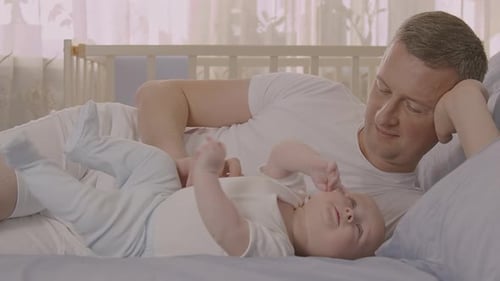 Five Month Old Baby Boy Playing On Bed With Father 1 422 Hq