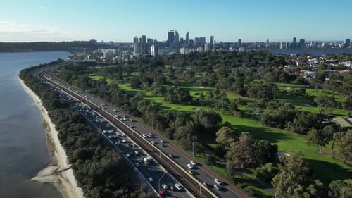 Drone Backwards Shot of Heavy Traffic on Coastal Road