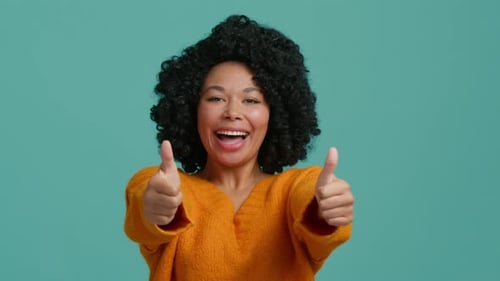 Smiling Woman Gives a Double Thumbs Up
