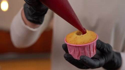 Filling Cupcake with Red Filling in Kitchen