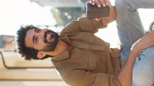 Young Indian Man Enjoying Drinking Morning Coffee Hot Drink Relaxing Taking a Break in City Street