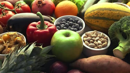 Vibrant Fruits, Vegetables, and Nuts Still Life