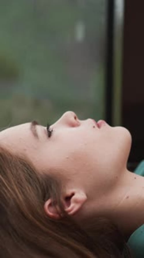 Close Up Of A Young Adult In The Rain