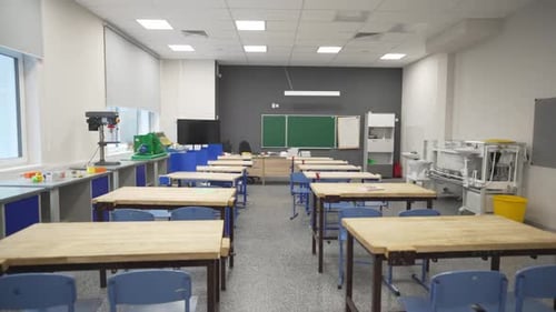 Empty Classroom with Desks and Chairs