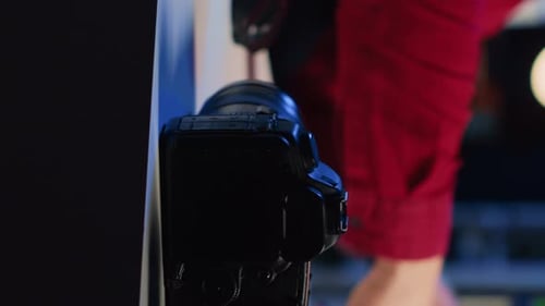 Man Reviewing Photos on Digital Camera