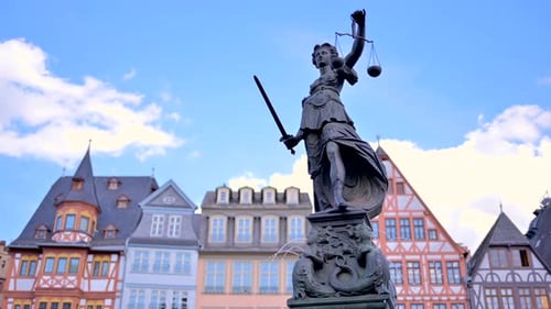 Justice fountain square statue and buildings in Frankfurt, Germany