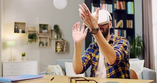 Man Experiencing Virtual Reality Headset at Home