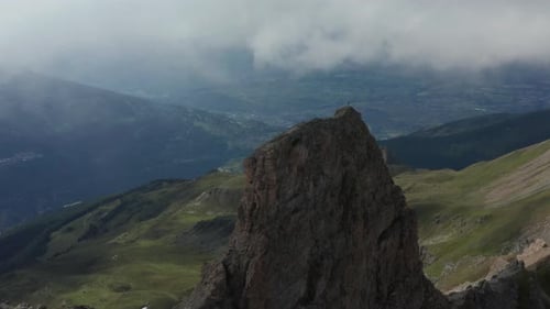 Flying towards mountain top with a Gipfelkreuz or summit cross on top