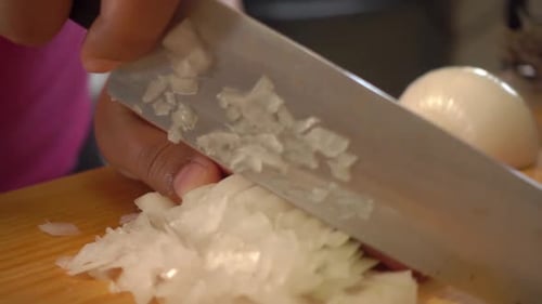 Dicing White Onion on Wooden Cutting Board