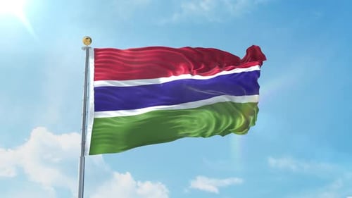 Realistic Flag of The Gambia Waving in Blue Sky
