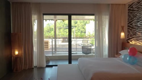 An Elegant Interior Of A Resort Hotel Accommodation In Bali, Indonesia. Sideways Shot