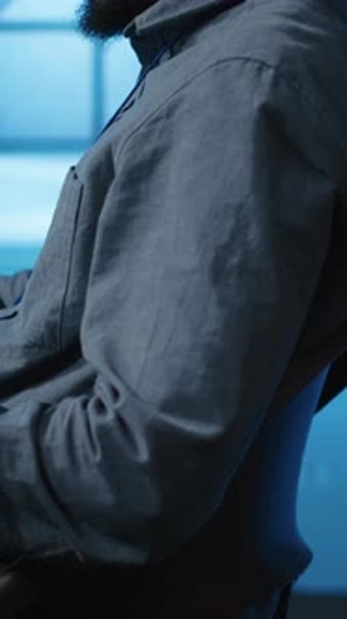 Vertical Video IT Programmer at PC Desk Typing on Keyboard Updating Servers Close Up