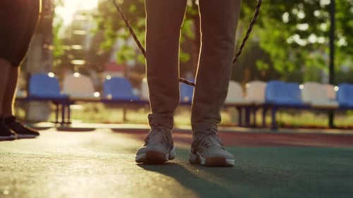 Closeup Unrecognizable Man Jumping Skipping Rope in Sport Playground Outdoor. Unknown Guy