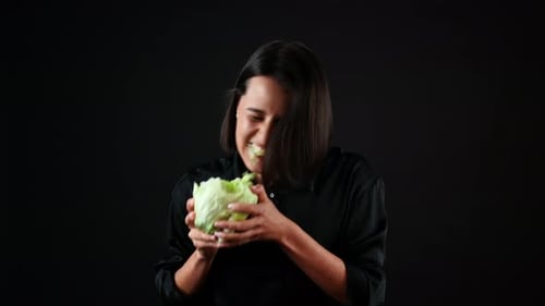 Portrait of Young Woman Biting Cabbage and Enjoying in Taste, Organic Vegan Healthy Food Concept