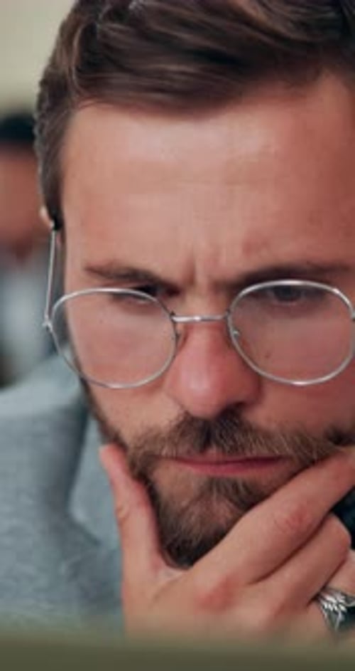 Man, journalist and thinking with computer in office, review and reading with insight