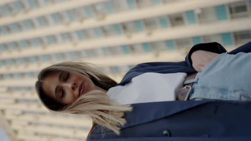 Stylish Woman Posing in Front of Building