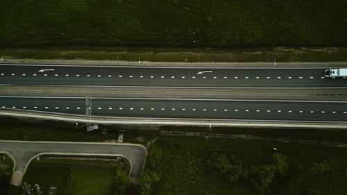 Admire Highway Traffic and Cityscape From Above Watch Cars Moving on the Open Road Explore the