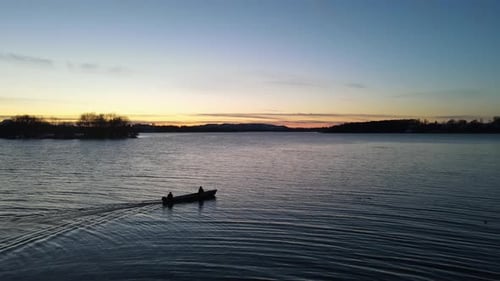 Sunset boat ride on lake with beautiful view