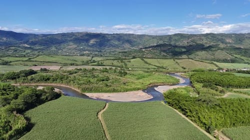 Meandering river cutting through green wilderness