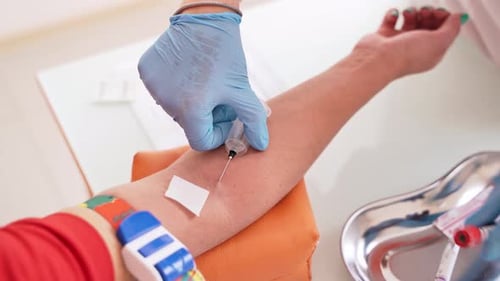 Patient during blood collection. Nurse taking blood sample for test in laboratory