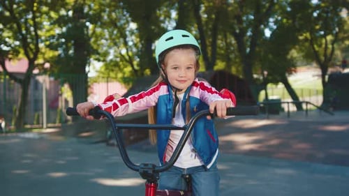 Girl Putting On Helmet Before Riding Bike, Kids Stock Footage ft. child & helmet - Envato Girl Putting On Helmet Before Riding Bike, Kids Stock Footage ft. child & helmet - Envato