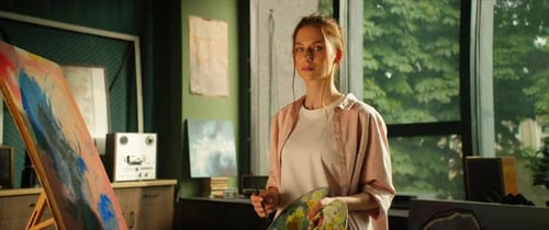 Woman Painting Abstract Art in Her Home Studio