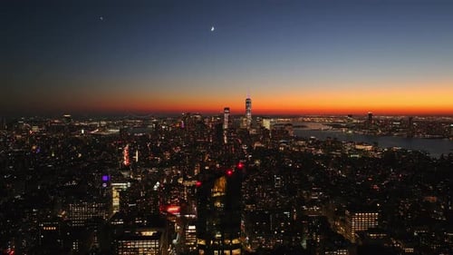 Crescent Moon Rises Over Midtown Manhattan New York City Lights of Skyscrapers are Turning on As the